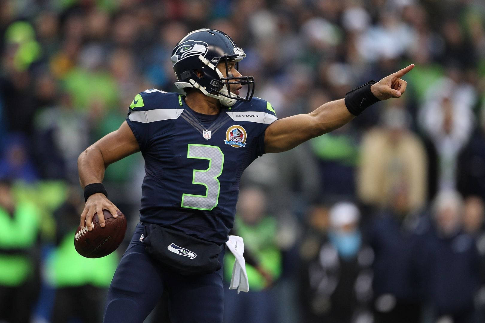 Russel Wilson Pointing During Game Background