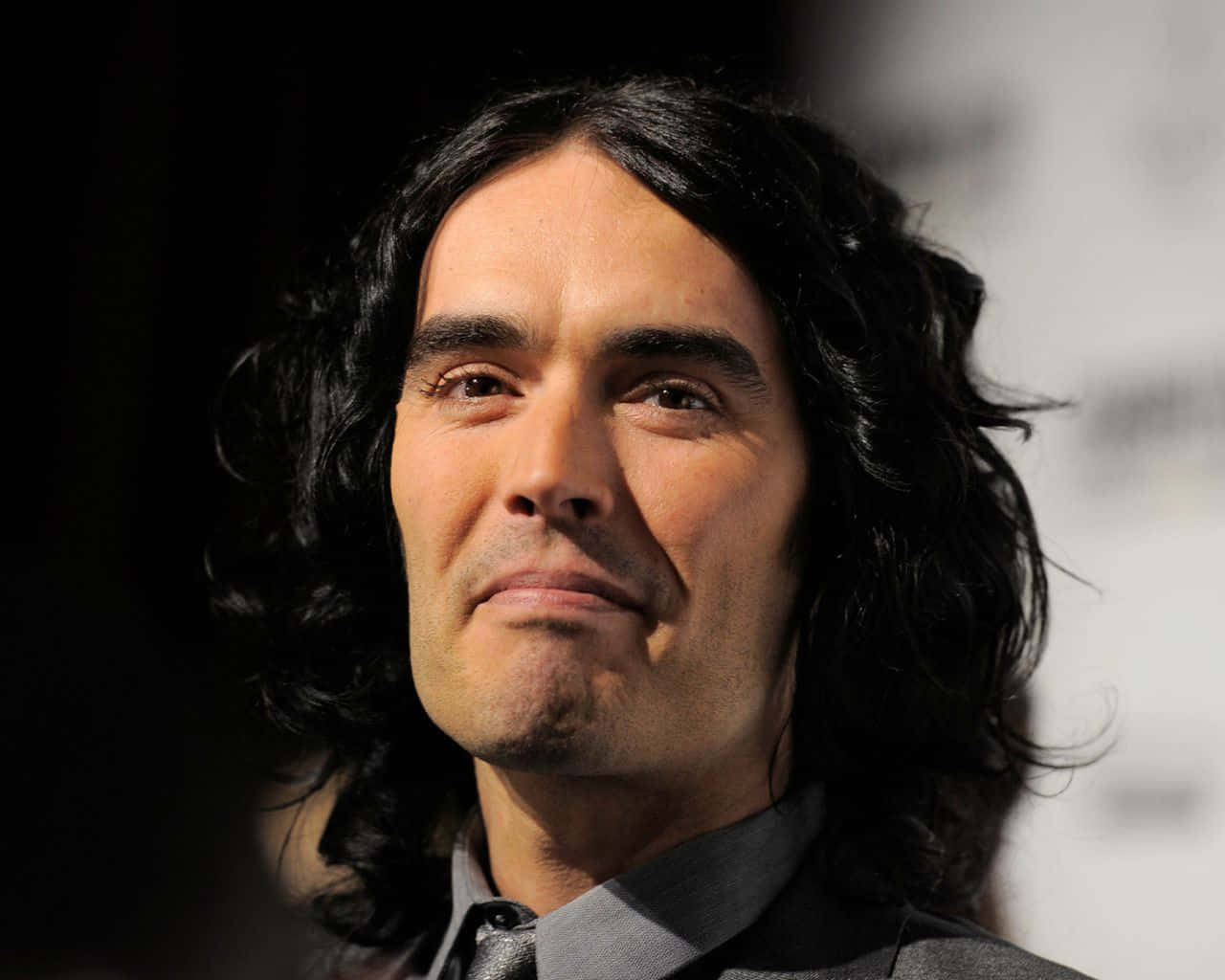 Russell Brand Clean Shaven Face Background