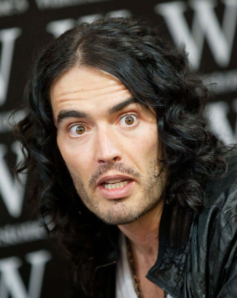 Russell Brand Shocked Look Background