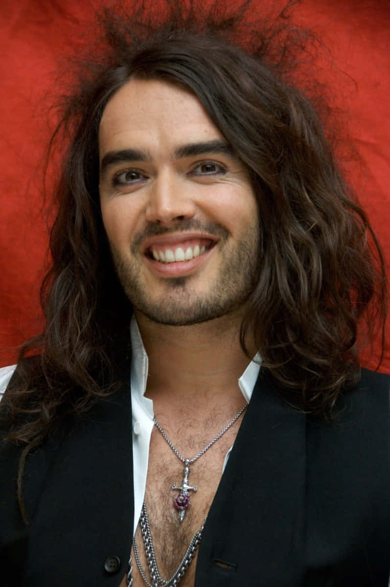 Russell Brand Smiling Actor Background