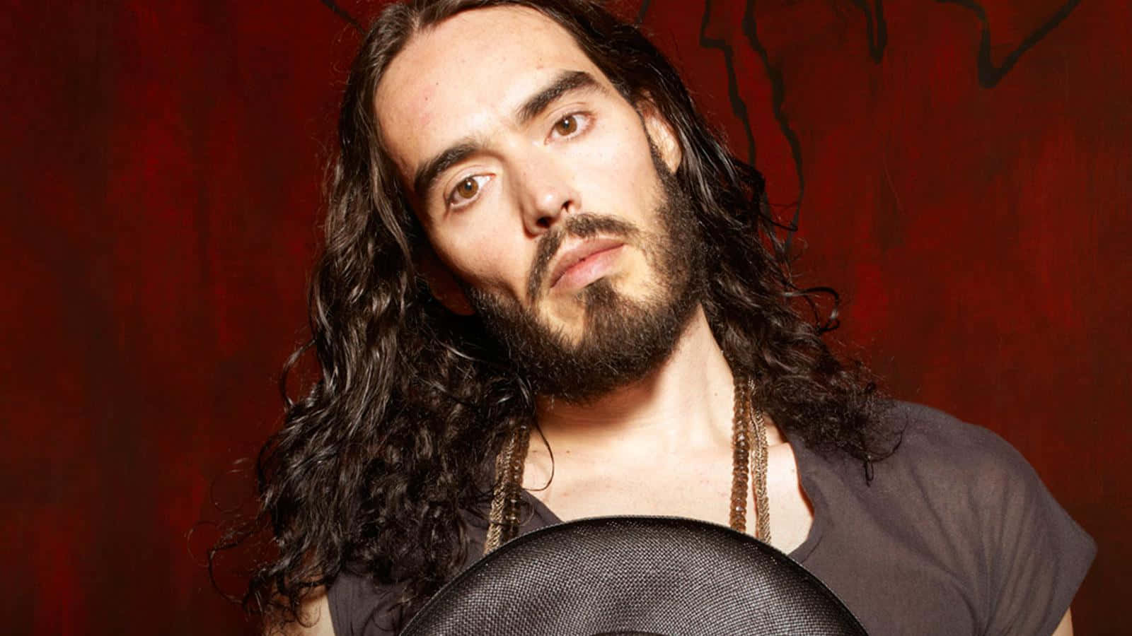 Russell Brand - The Pioneering Genius Of Comedy Background