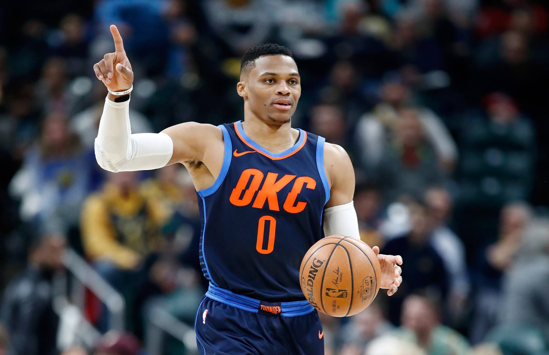 Russell Westbrook Raising One Finger Dribbling Background