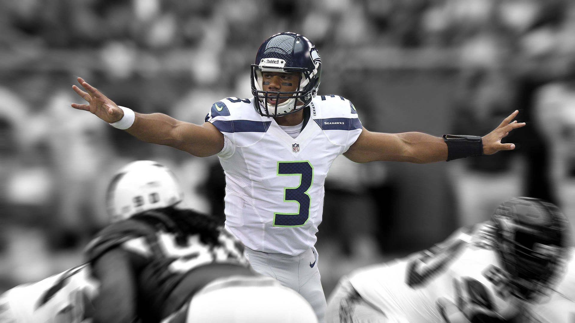 Russell Wilson Holding Hands Up Black And White