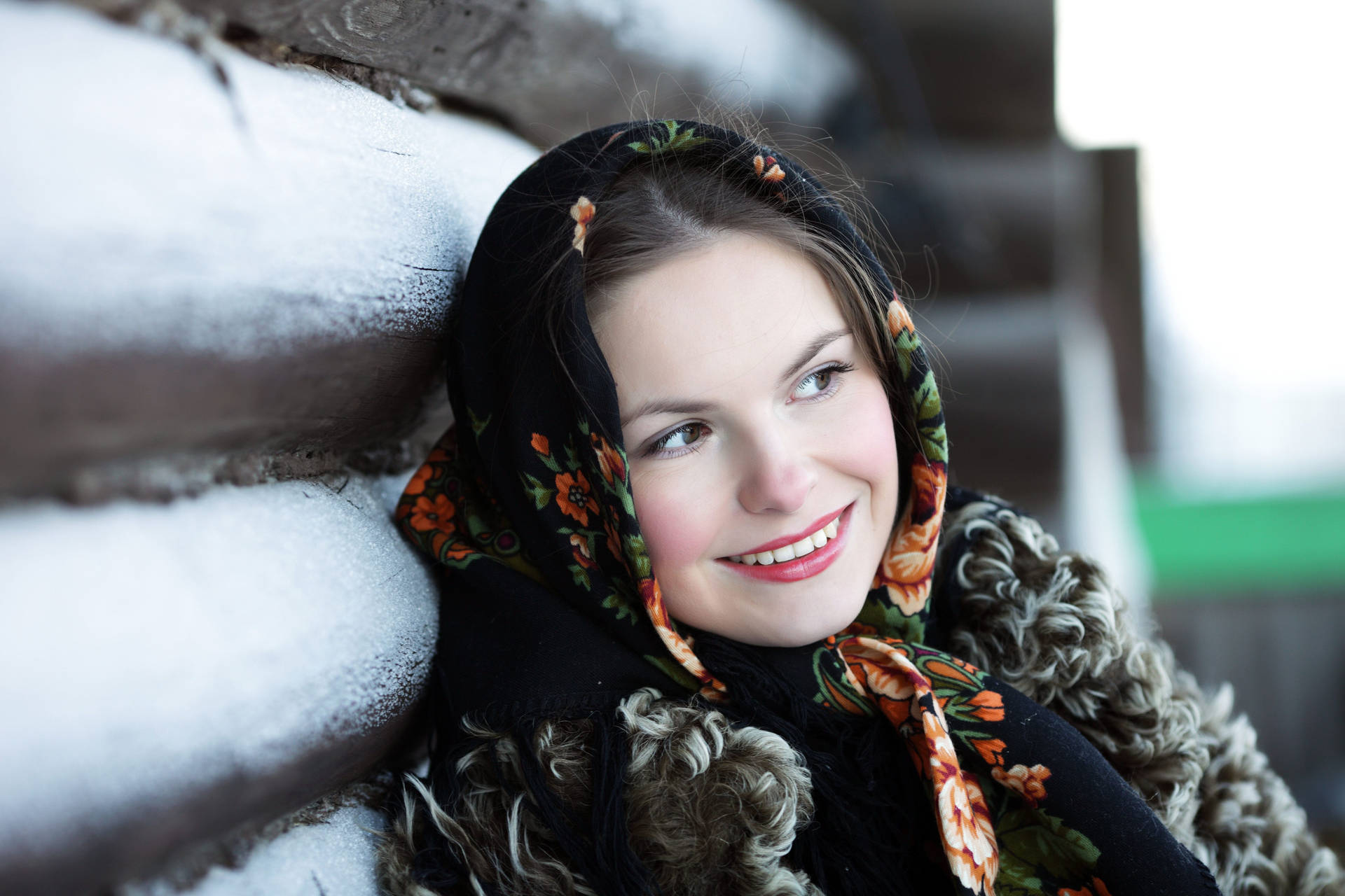 Russian Girl Leaning Against Snowy Wall Background