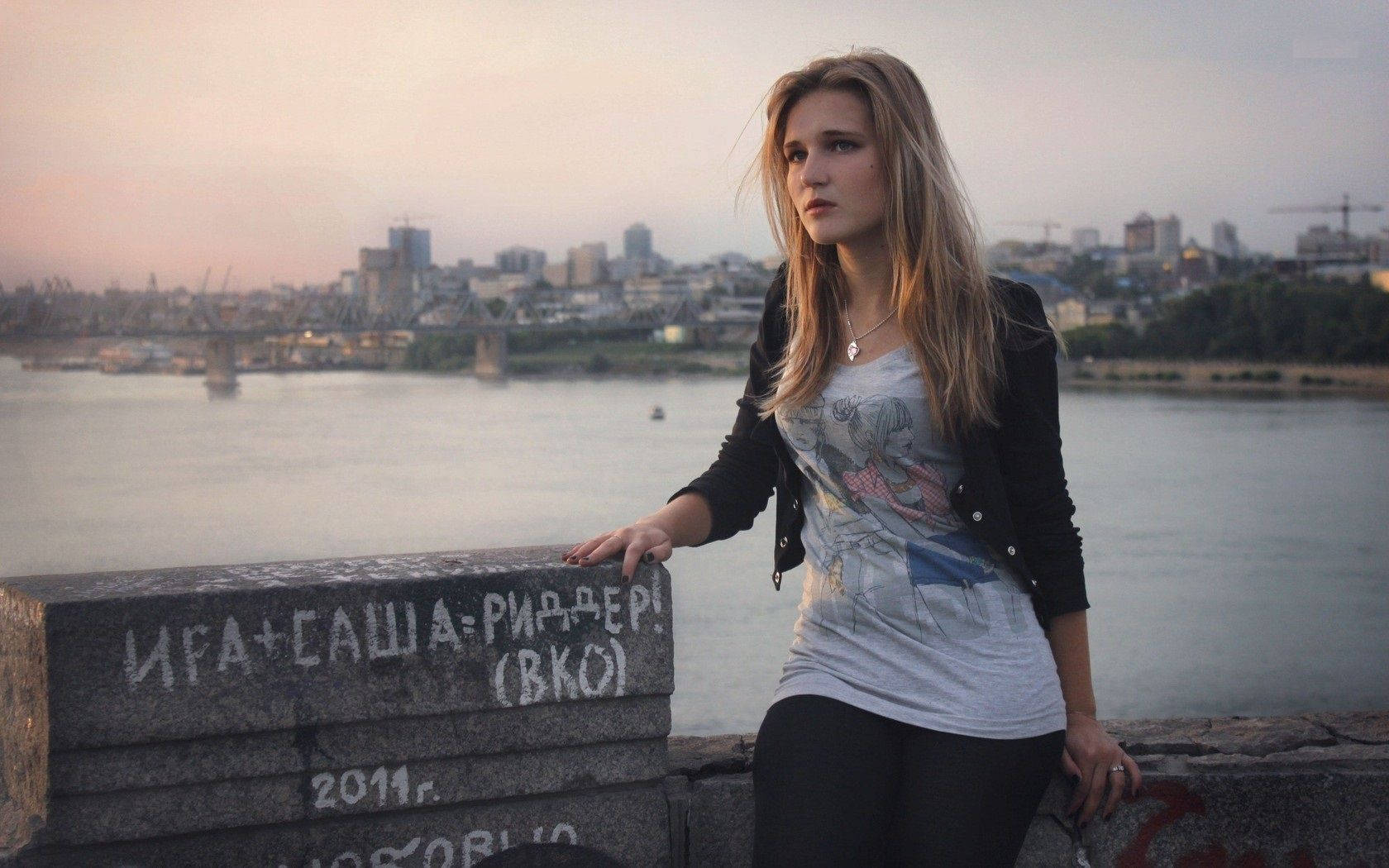 Russian Girl Sitting On A Concrete Wall