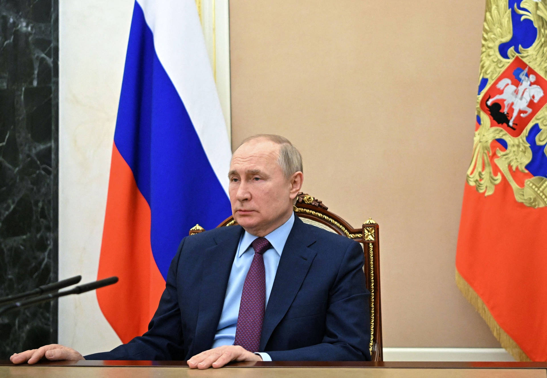 Russian President Vladimir Putin Exhibits A Calm Demeanor Background