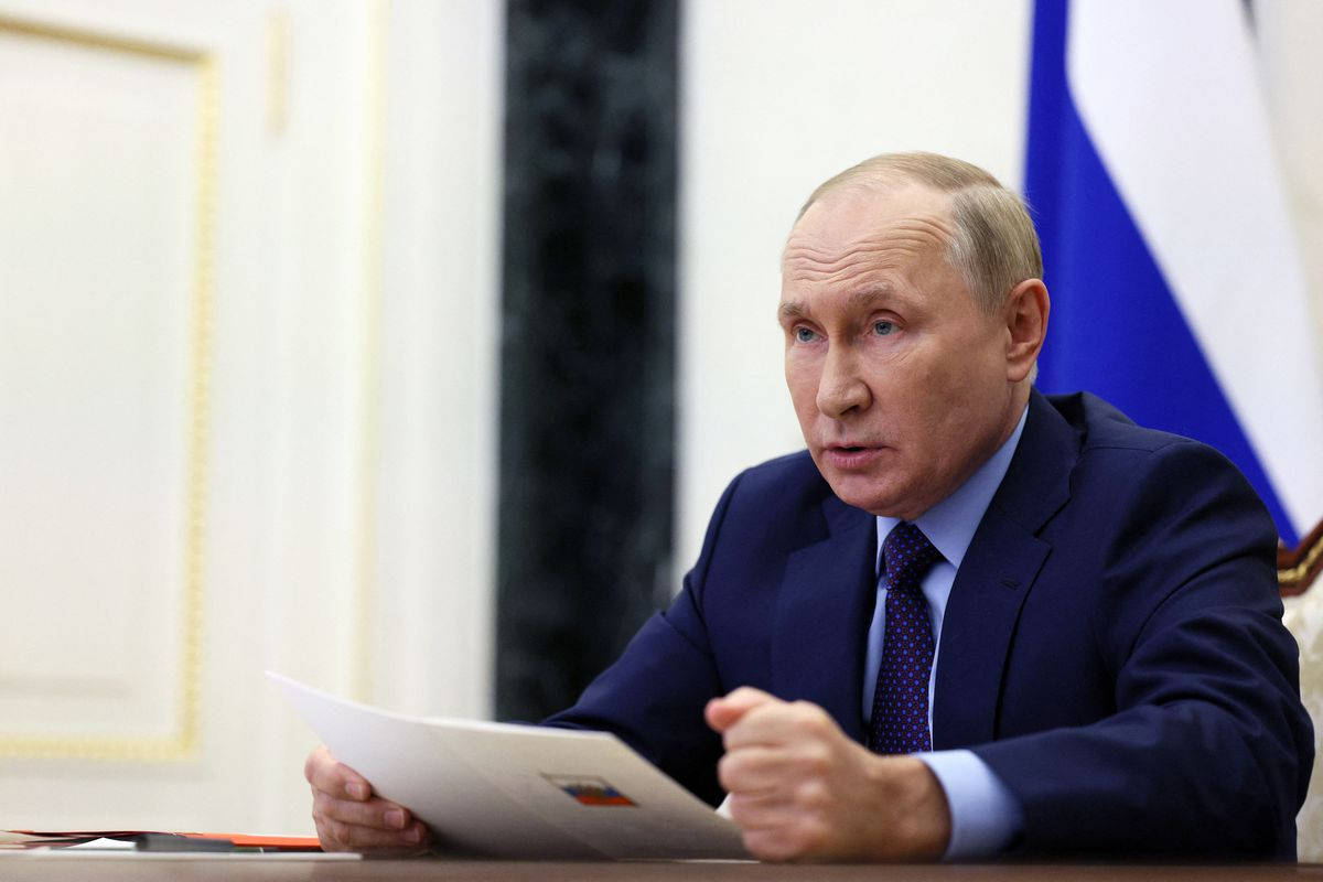 Russian President Vladimir Putin Expressing Point With Firm Fist On Table Background