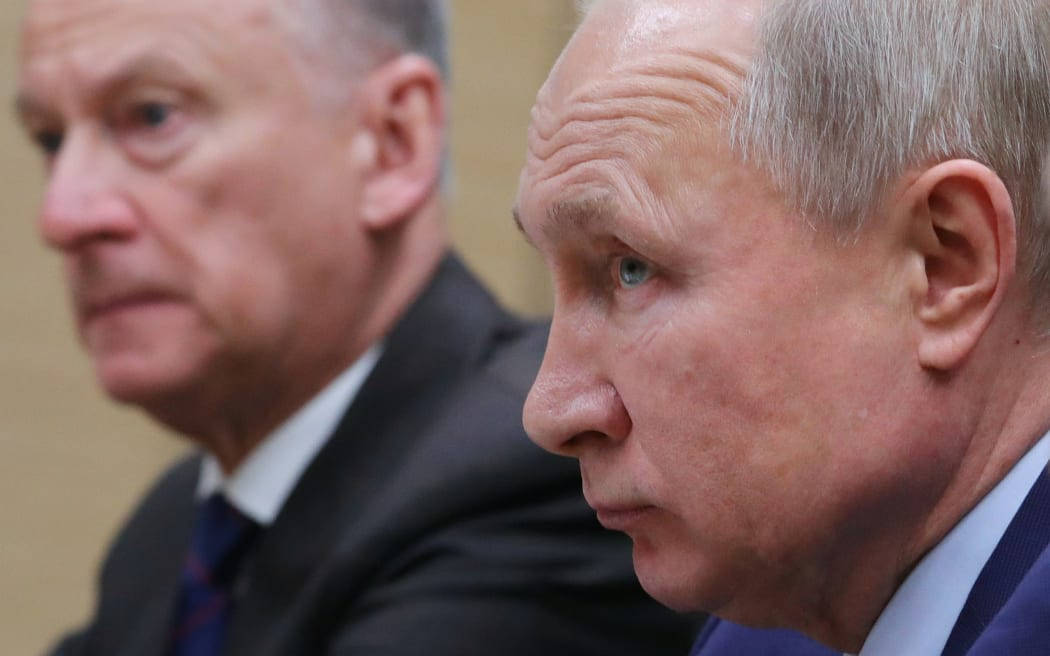 Russian President Vladimir Putin In Side Profile Background