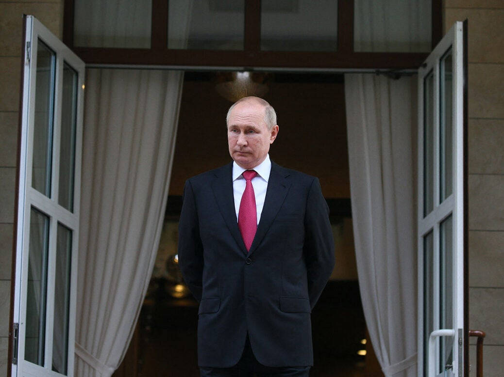 Russian President, Vladimir Putin Standing In Front Of Open Doors Background