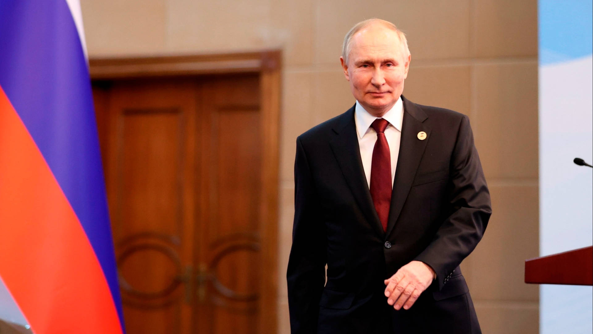 Russian President, Vladimir Putin, Striding Away From Podium Background