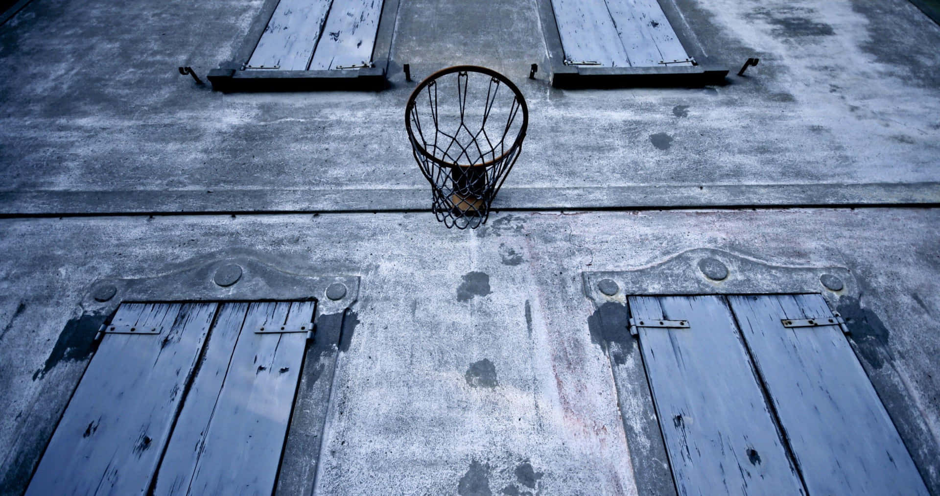 Rustic Basketball Hoopon Barn Wall Background