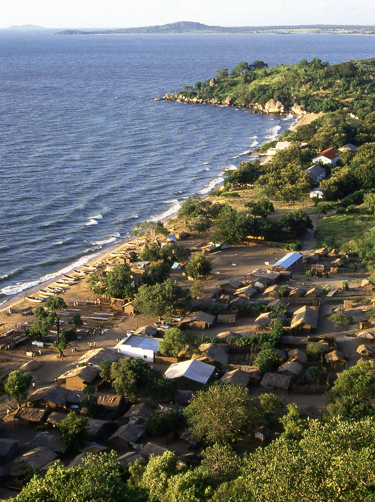 Rustic Houses Near Lake In Malawi