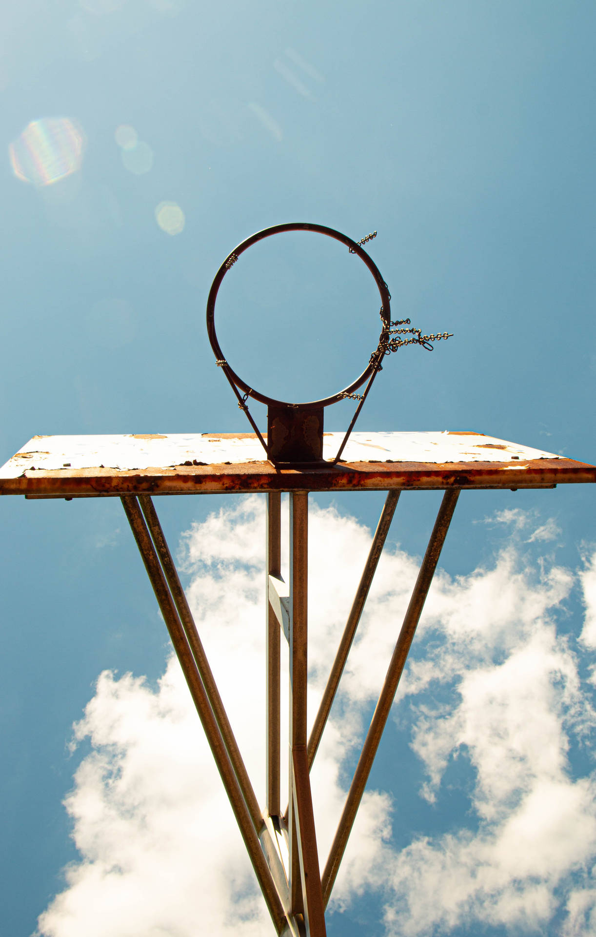 Rusty Basketball Hoop On Sky Background