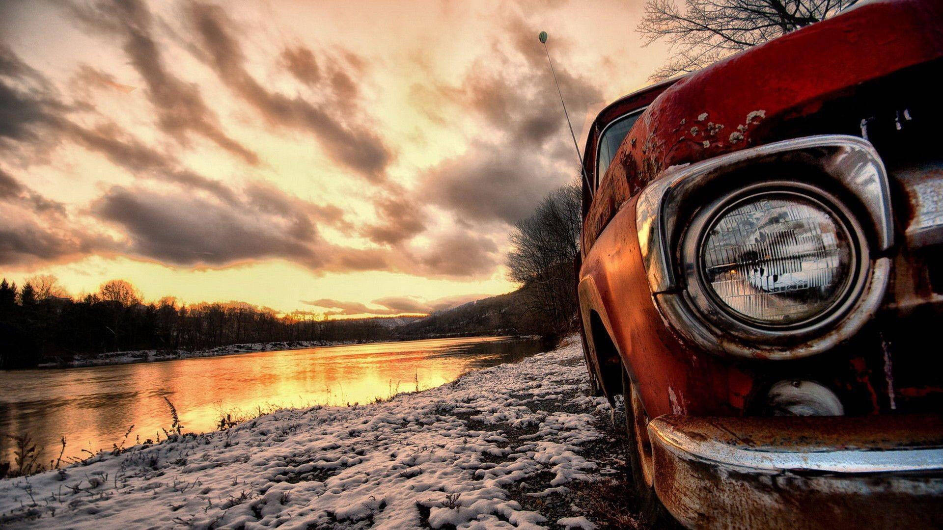 Rusty Old Car On The Riverside