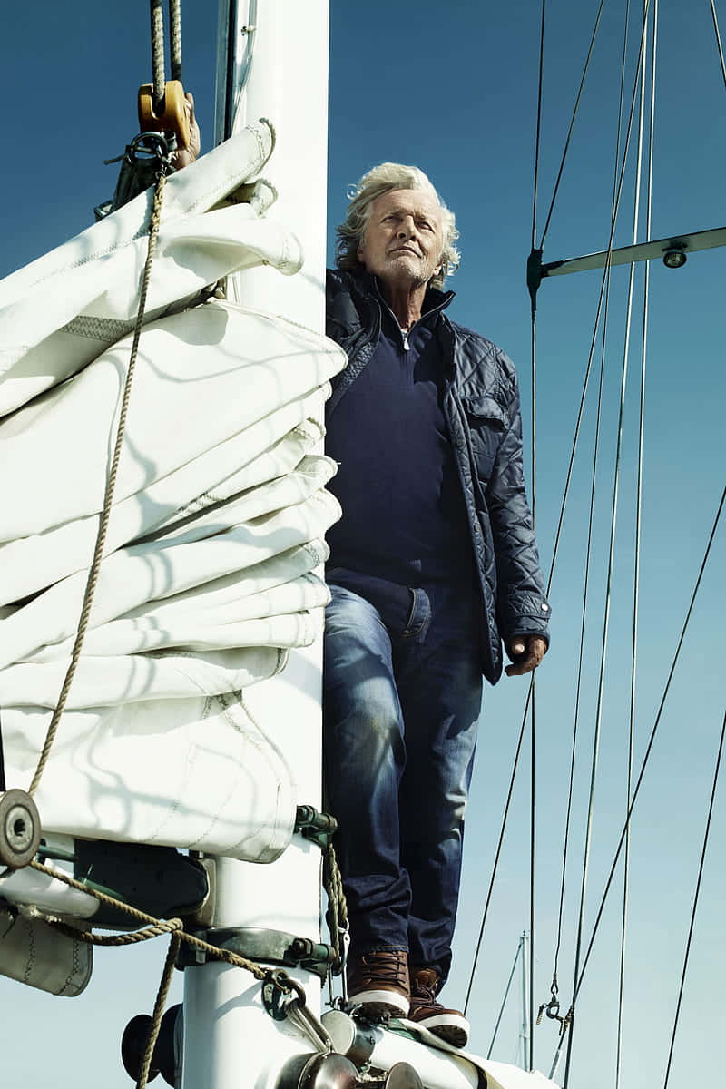 Rutger Hauer Actor On A Sailing Boat Background