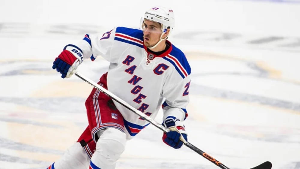 Ryan Mcdonagh New York Rangers Chase Puck Background