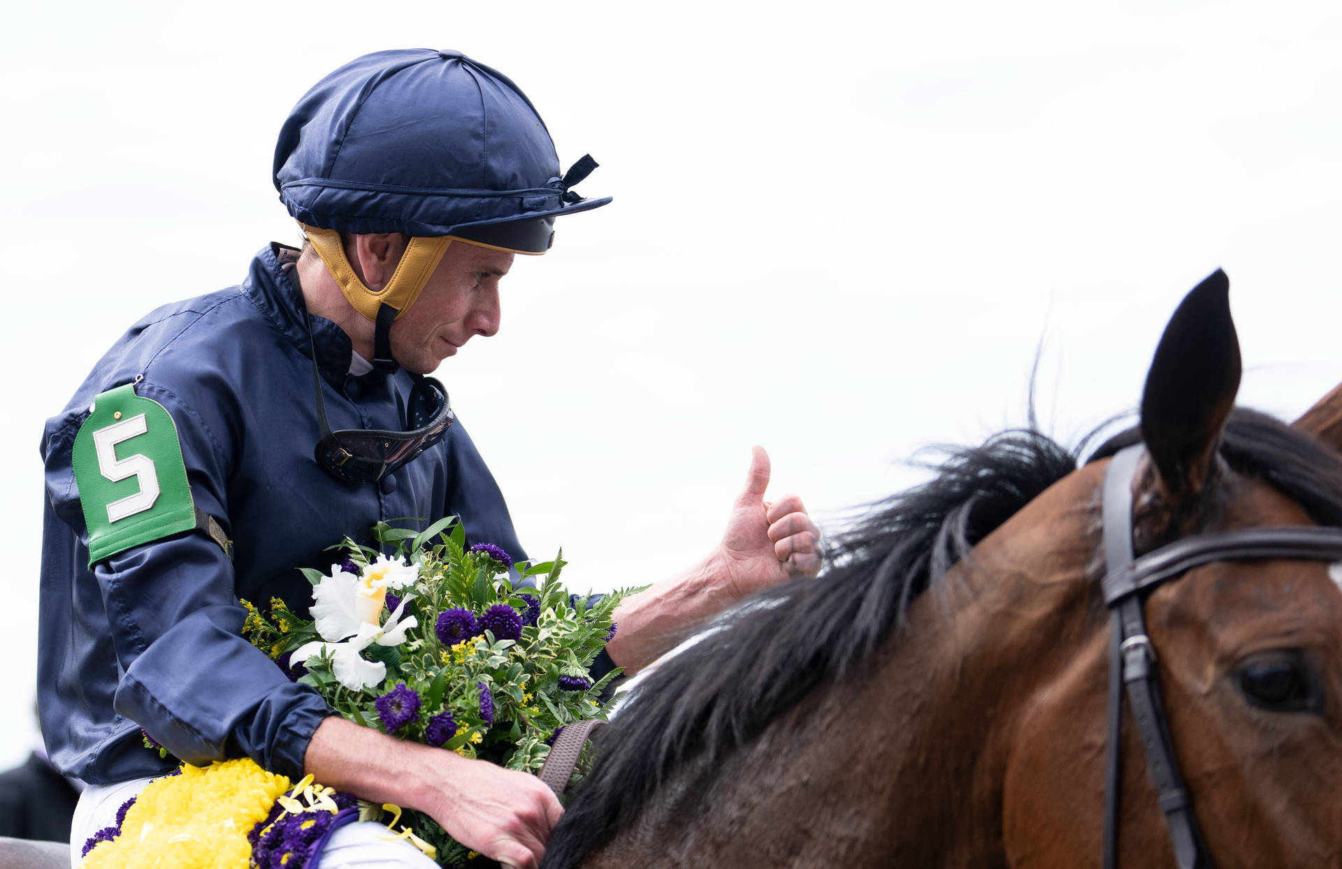 Ryan Moore Contemplating Strategy On Golf Course Background