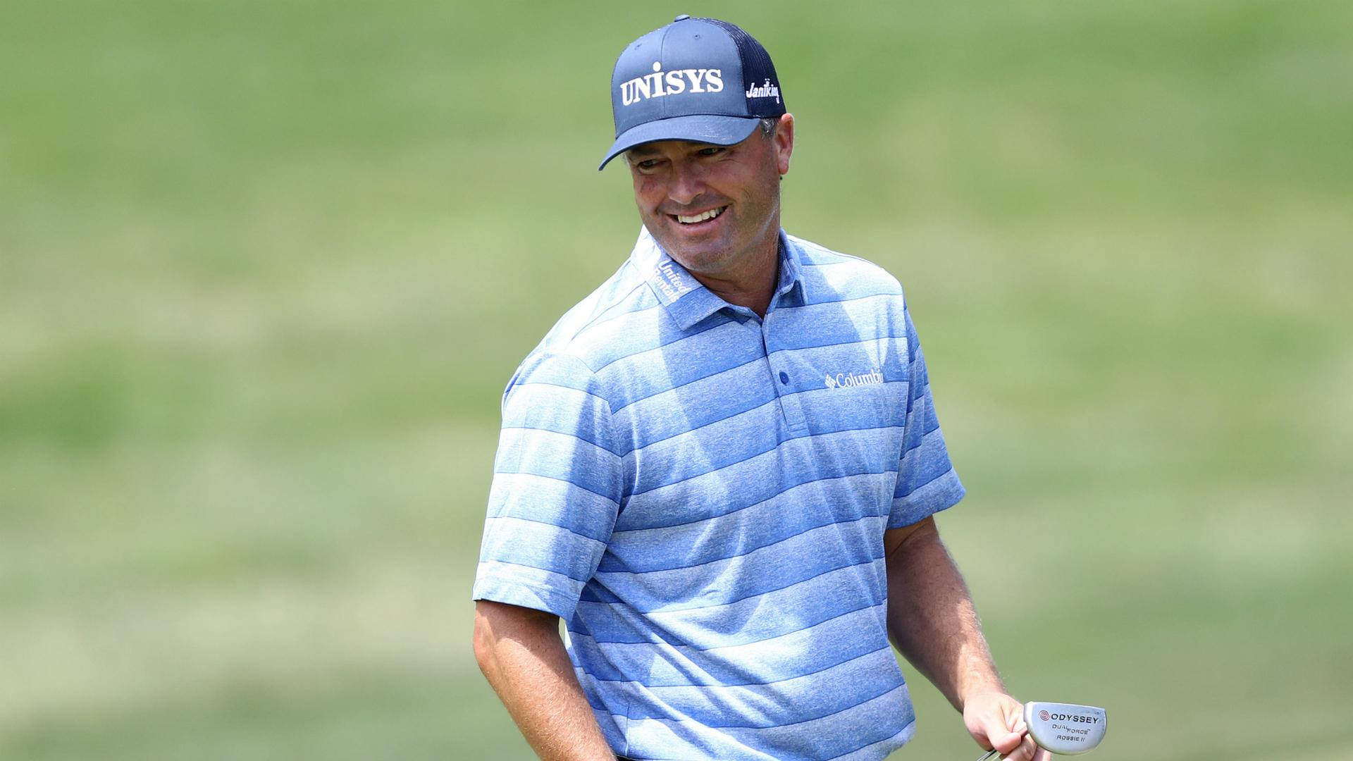 Ryan Palmer Blue Striped Shirt Smiling Background