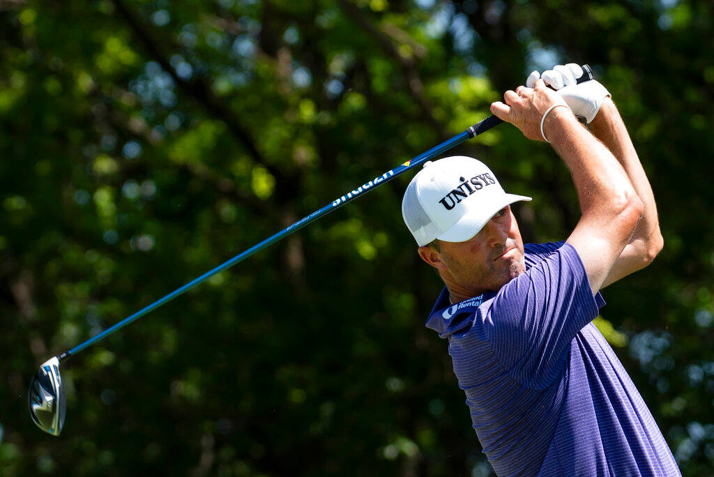 Ryan Palmer Golfing Among Trees Background