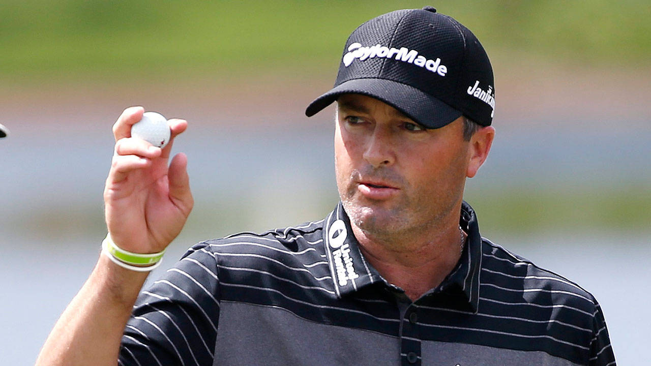 Ryan Palmer Holding Up Golf Ball Background