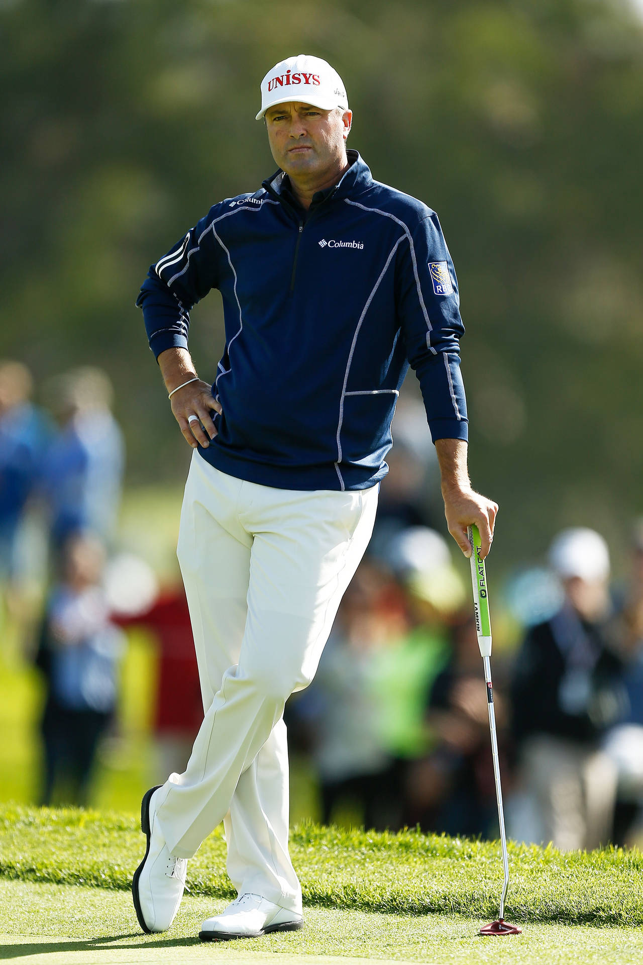 Ryan Palmer Leaning On Golf Club Background