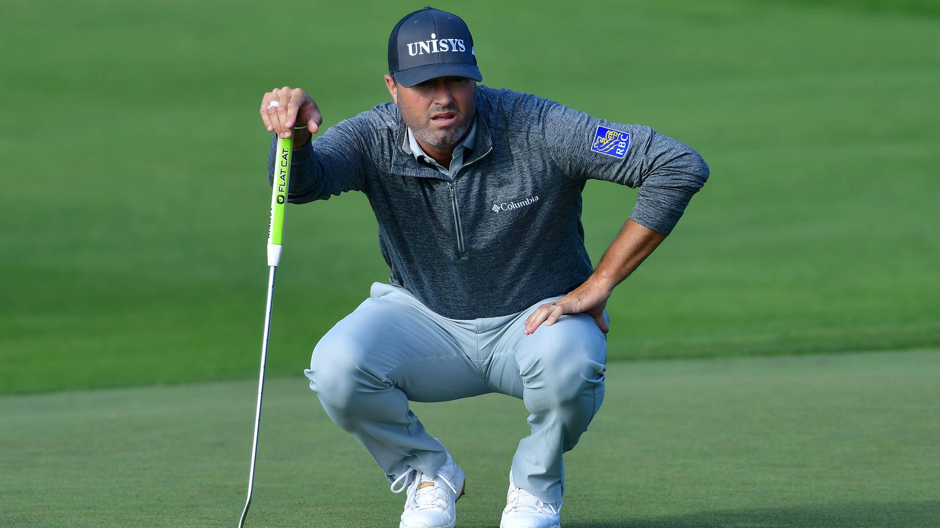 Ryan Palmer Squatting Observing Pitch Background