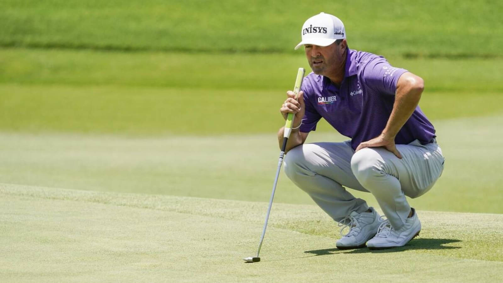 Ryan Palmer Squatting On Field Background