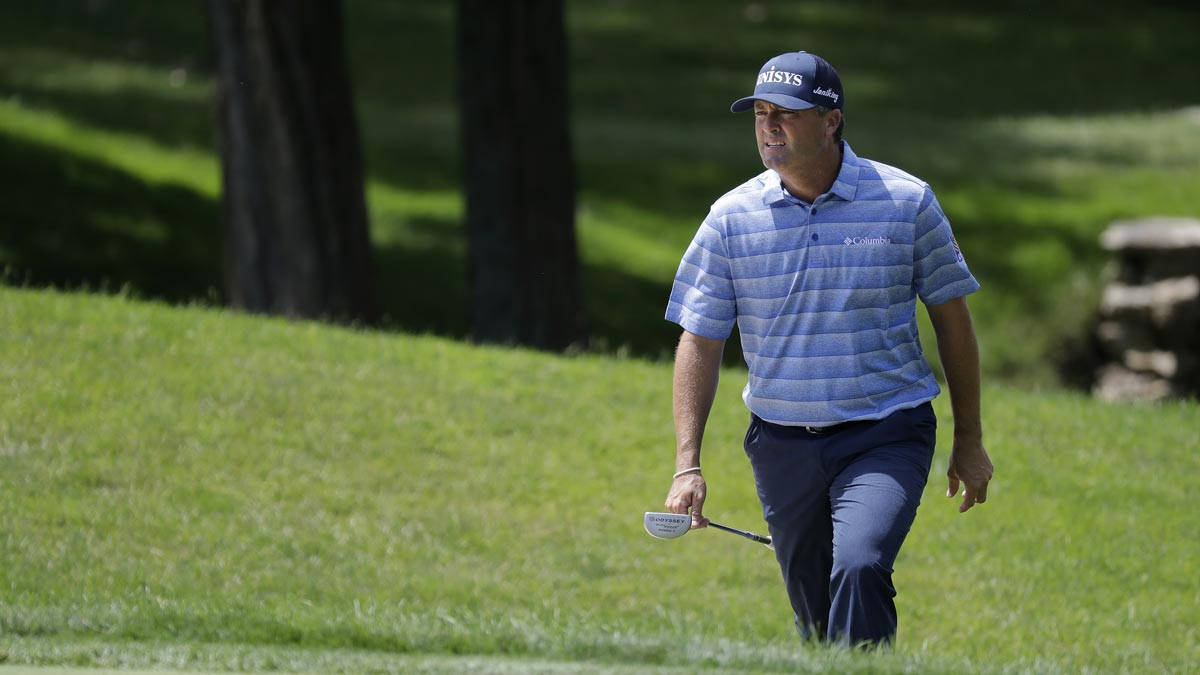 Ryan Palmer Walking Squinting On Course Background