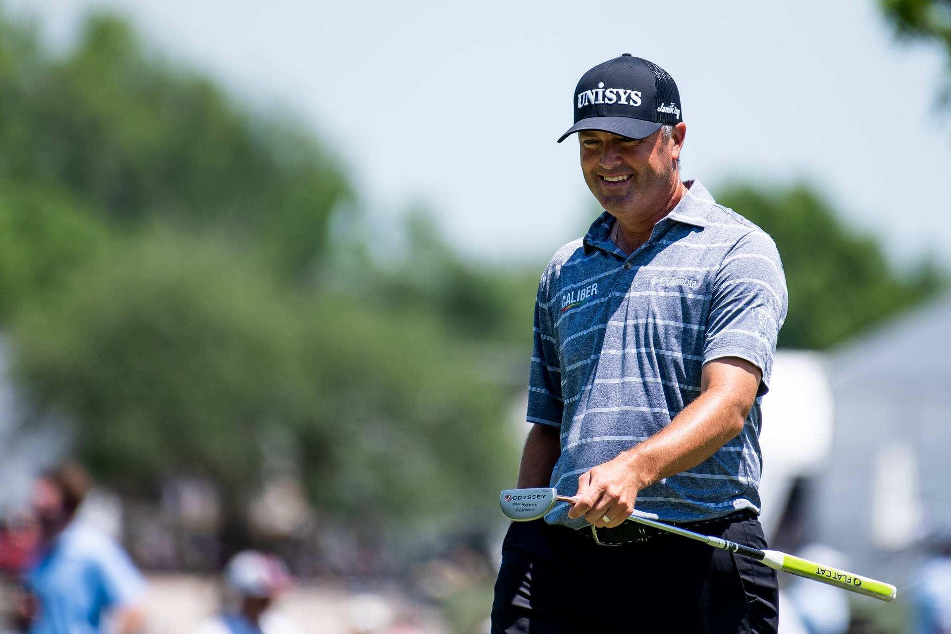 Ryan Palmer Wearing Blue Cap Smiling Background