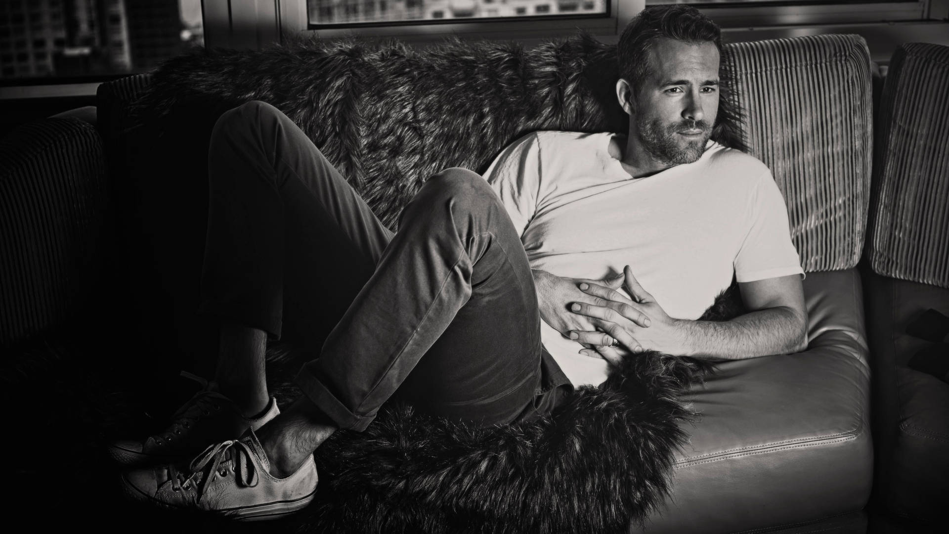 Ryan Reynolds On Sofa Monochrome Background