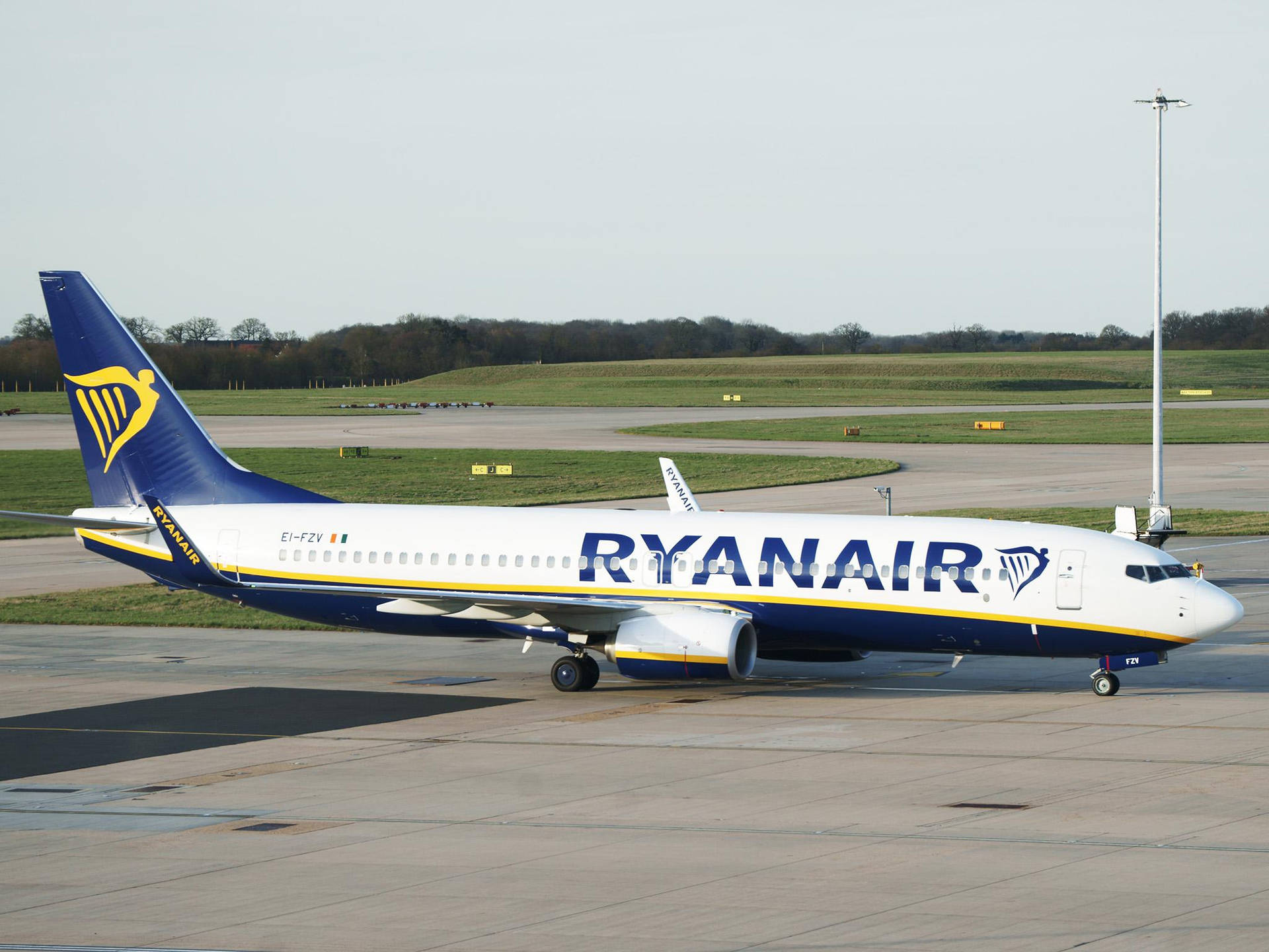 Ryanair Airplane On Airport Runway Background