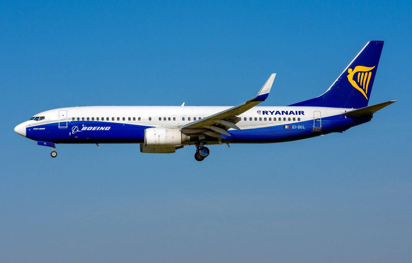 Ryanair Blue And White Plane In Sky Background