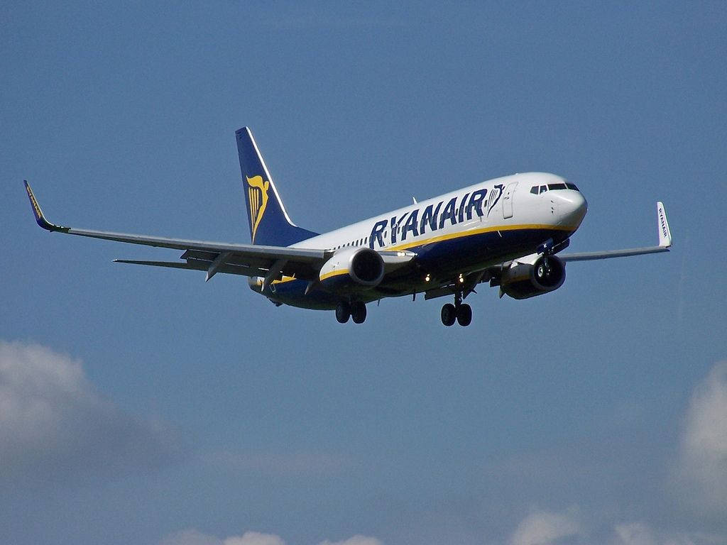 Ryanair Flying In Dark Blue Sky Background