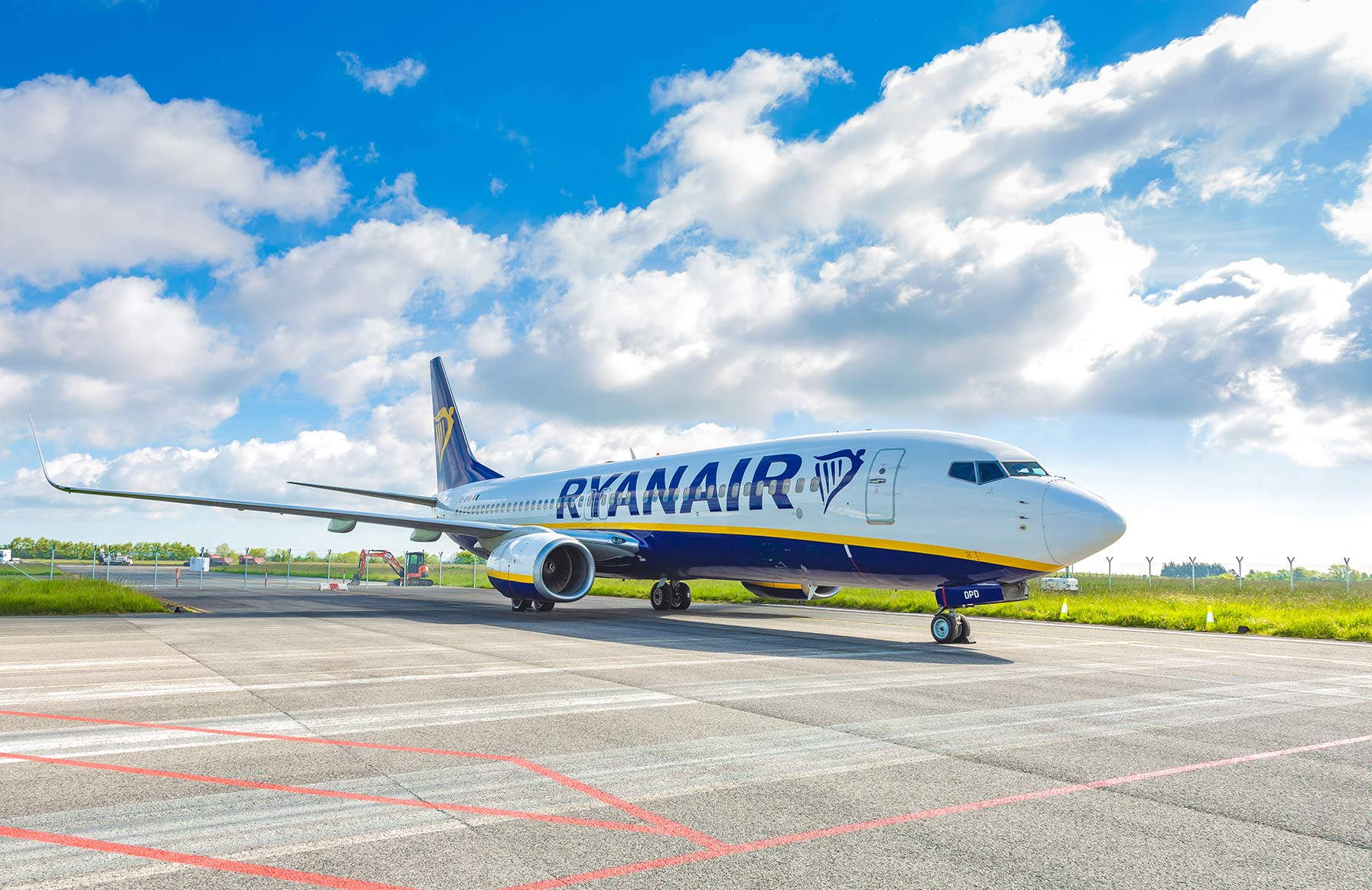 Ryanair Plane On Runway Under Sky Background