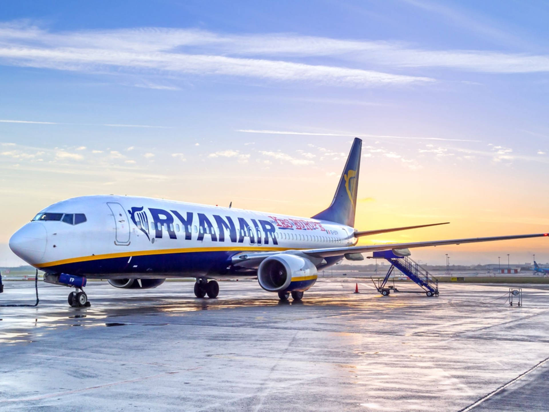 Ryanair Under Sunset Wet Airport Background