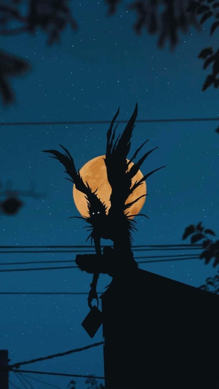 Ryuk Silhouette Against Moon Background