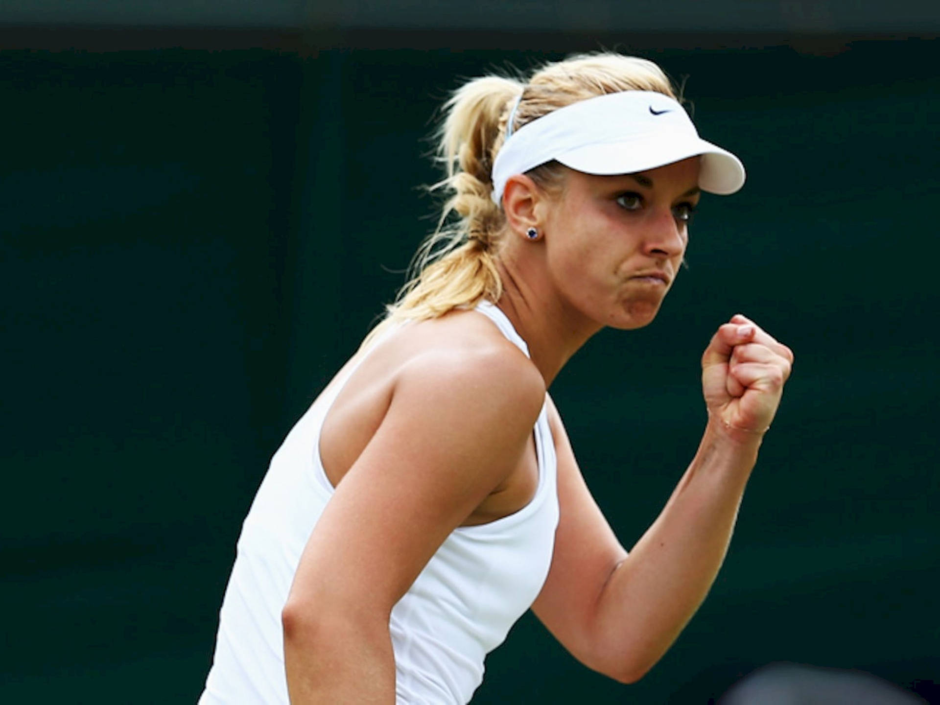 Sabine Lisicki Celebrating Victory With A Fist Pump Background