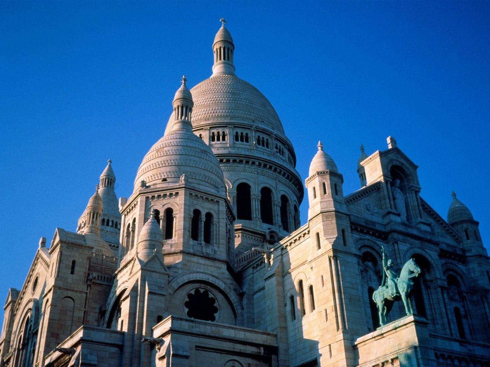 Sacre Coeur Basilica Domes And Statue Background