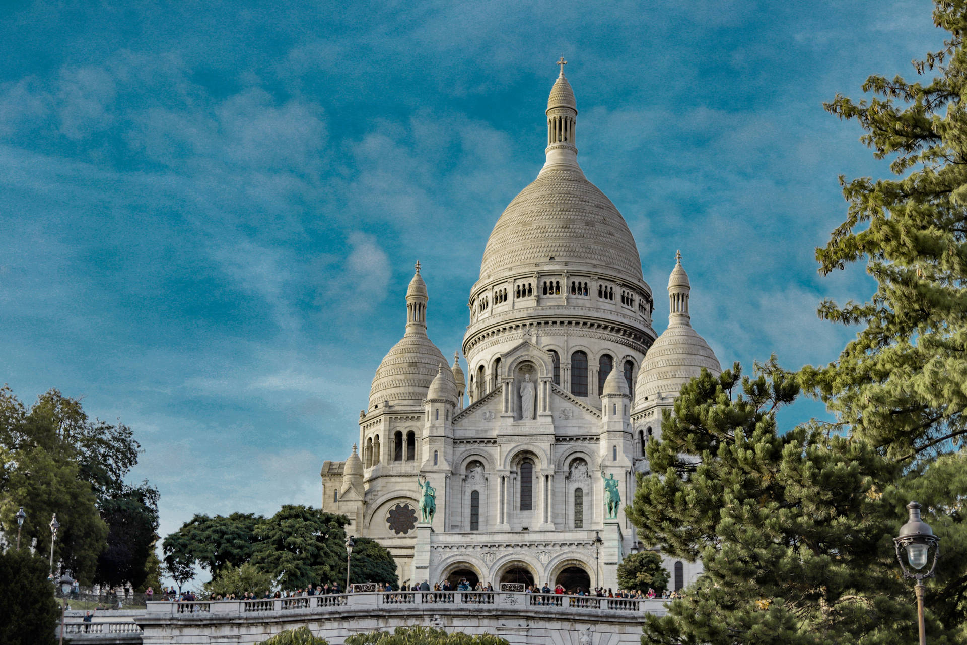 Sacre Coeur Basilica Surrounded By Trees Background