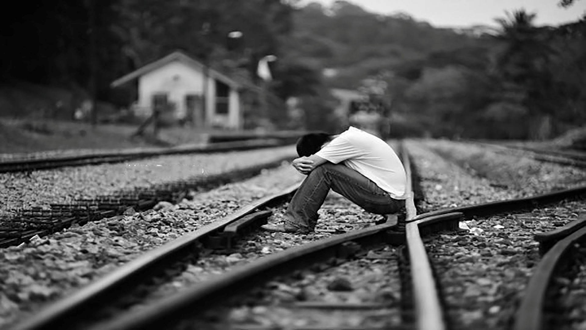 Sad Boy At Rail Tracks Background
