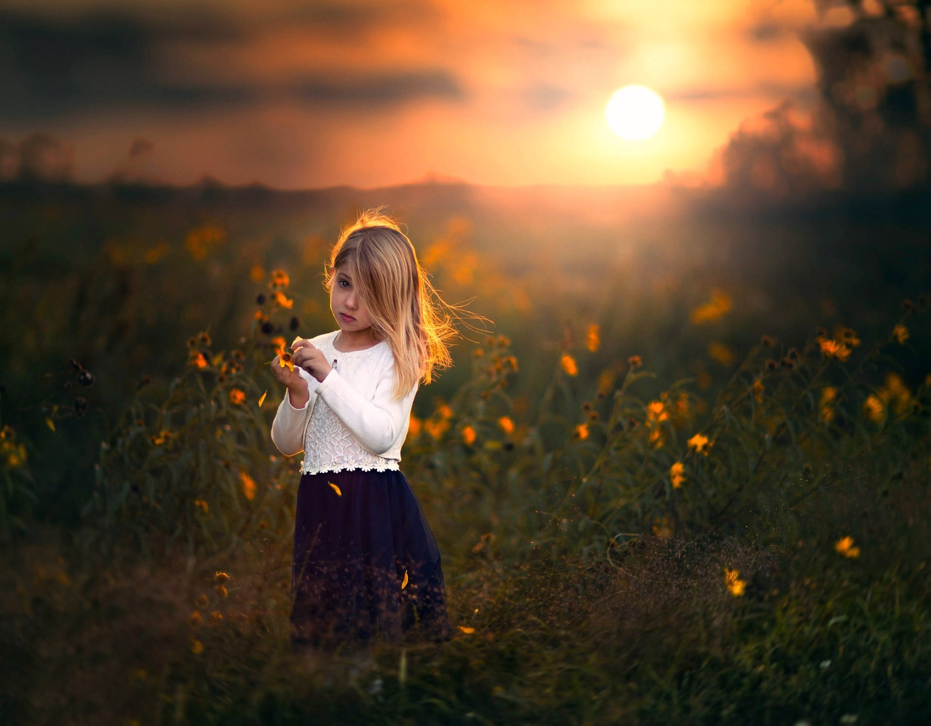 Sad Child And Flowers At Sunset