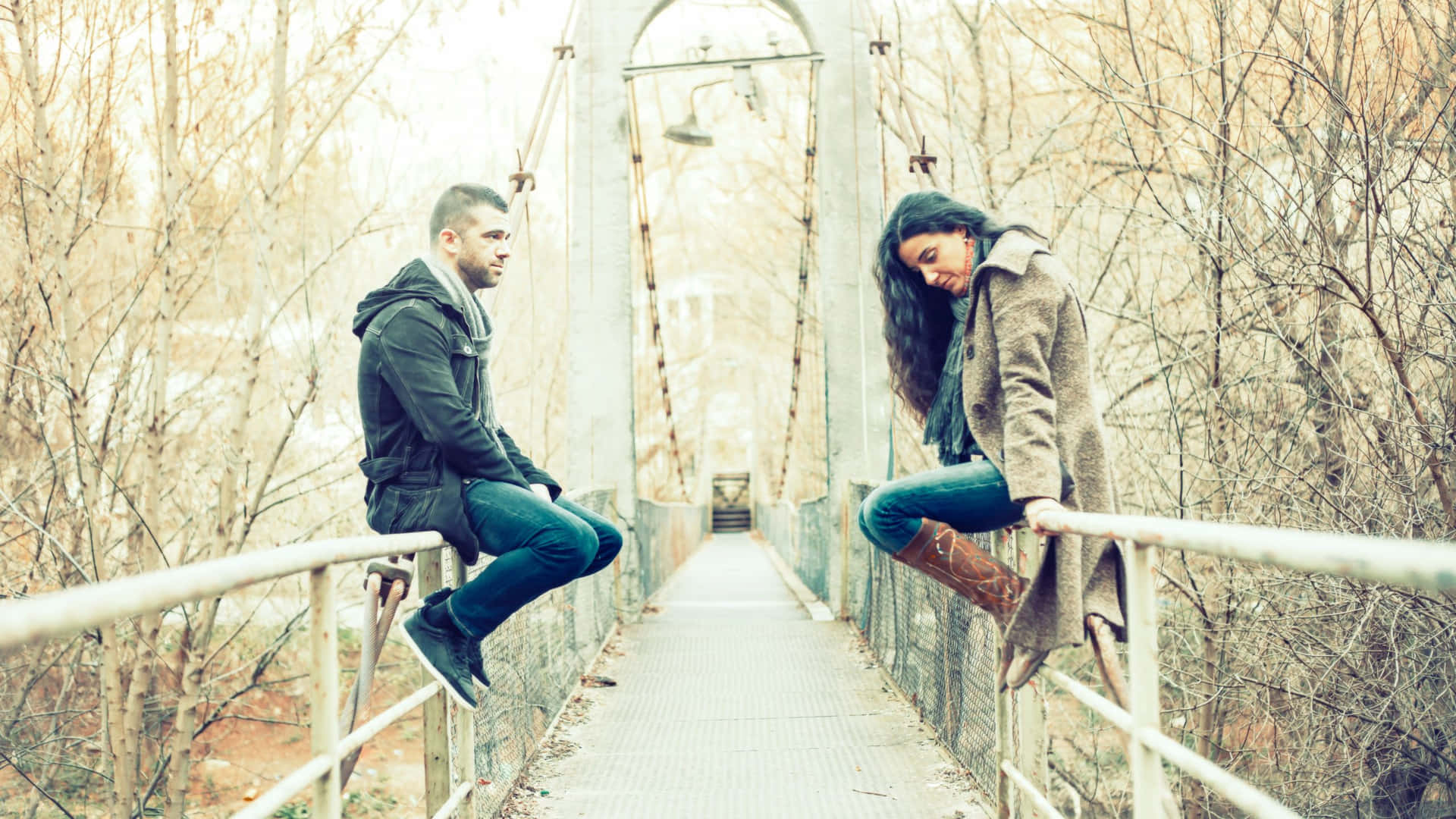 Sad Couple Sitting On The Bridge