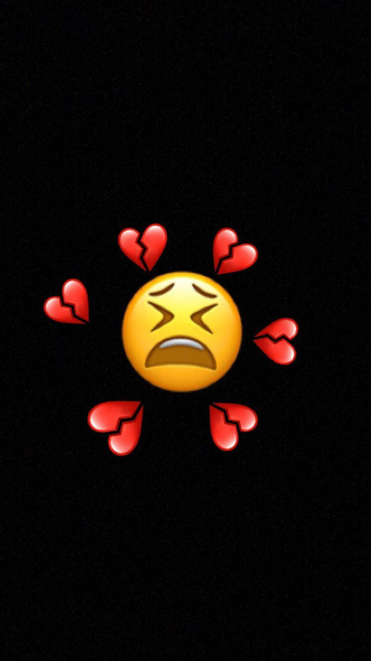 Sad Emoji Amidst Broken Heart Iphone Background