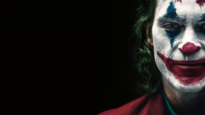 Sad Joker Half Face With Black Background Background