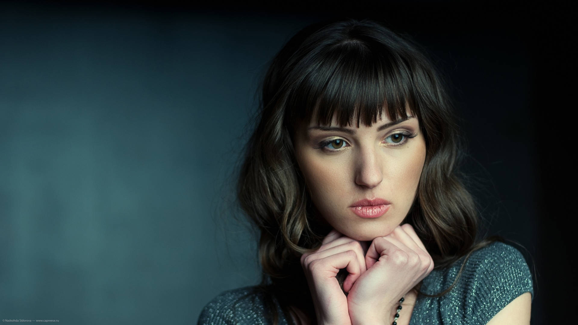 Sad Women With Wavy Hairs And Bangs Background