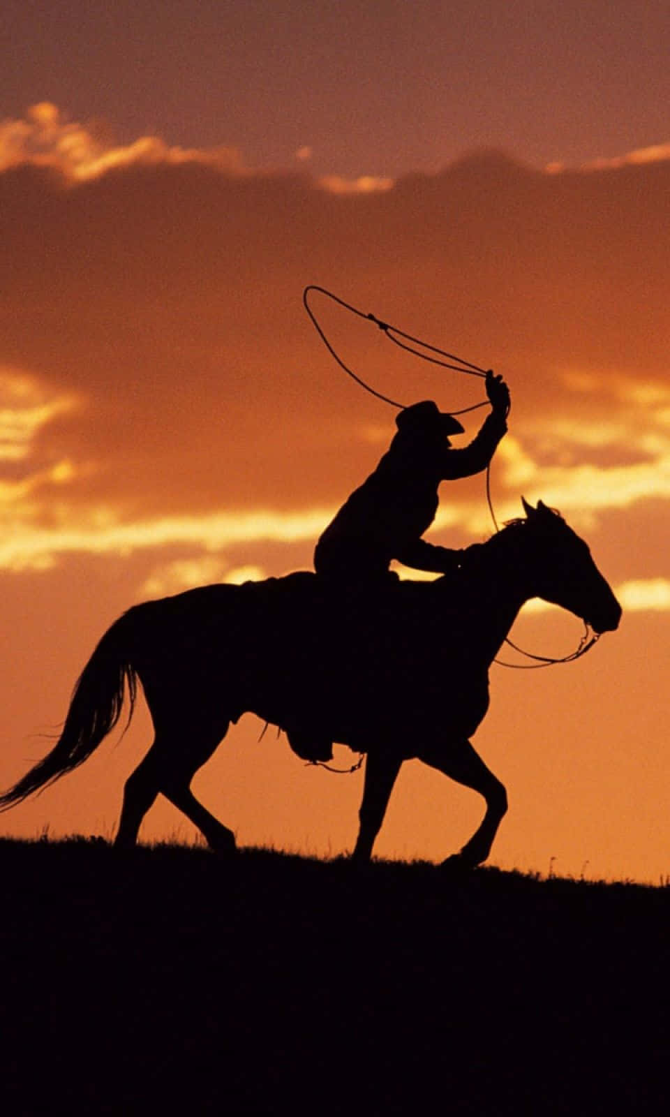 Saddle Up And Get Ready To Ride With This Cowboy Iphone Wallpaper. Background