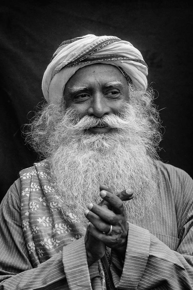 Sadhguru Intertwining His Fingers Background