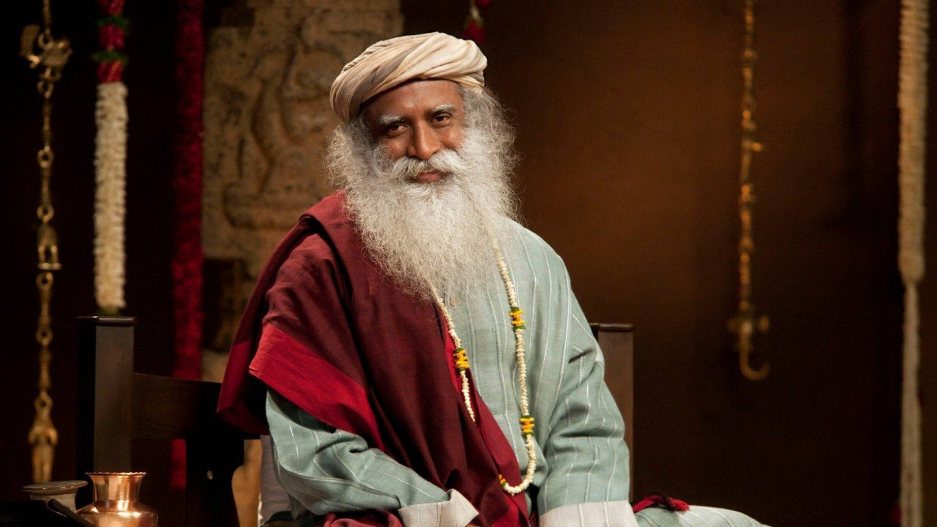 Sadhguru Sitting And Smilling Background