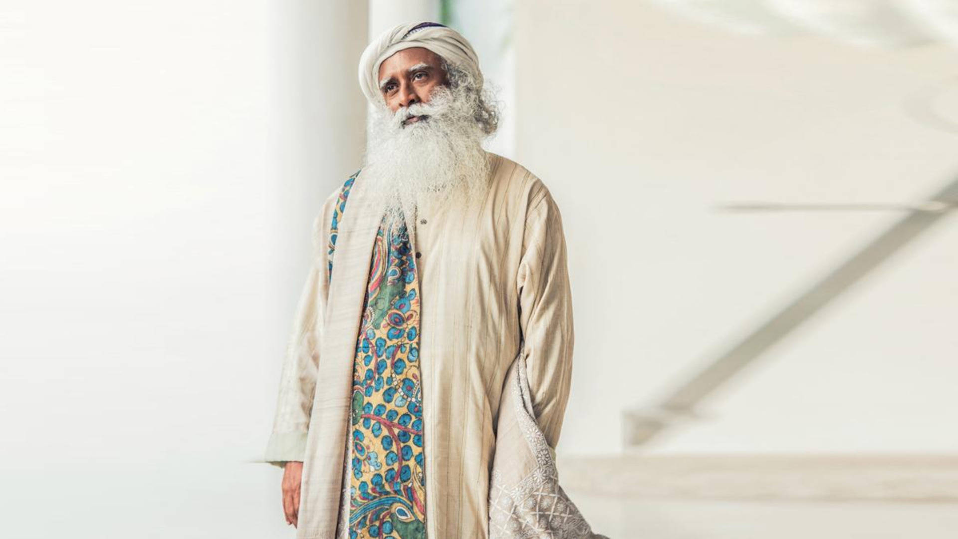 Sadhguru Standing On A White Hall Background