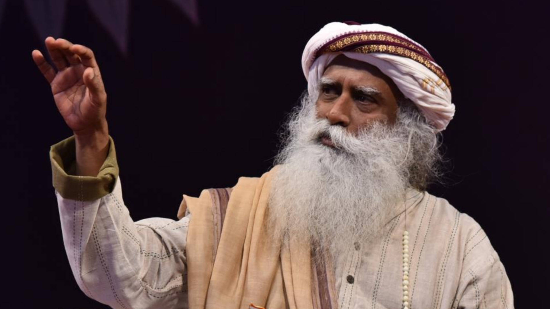 Sadhguru With A Raised Hand Background